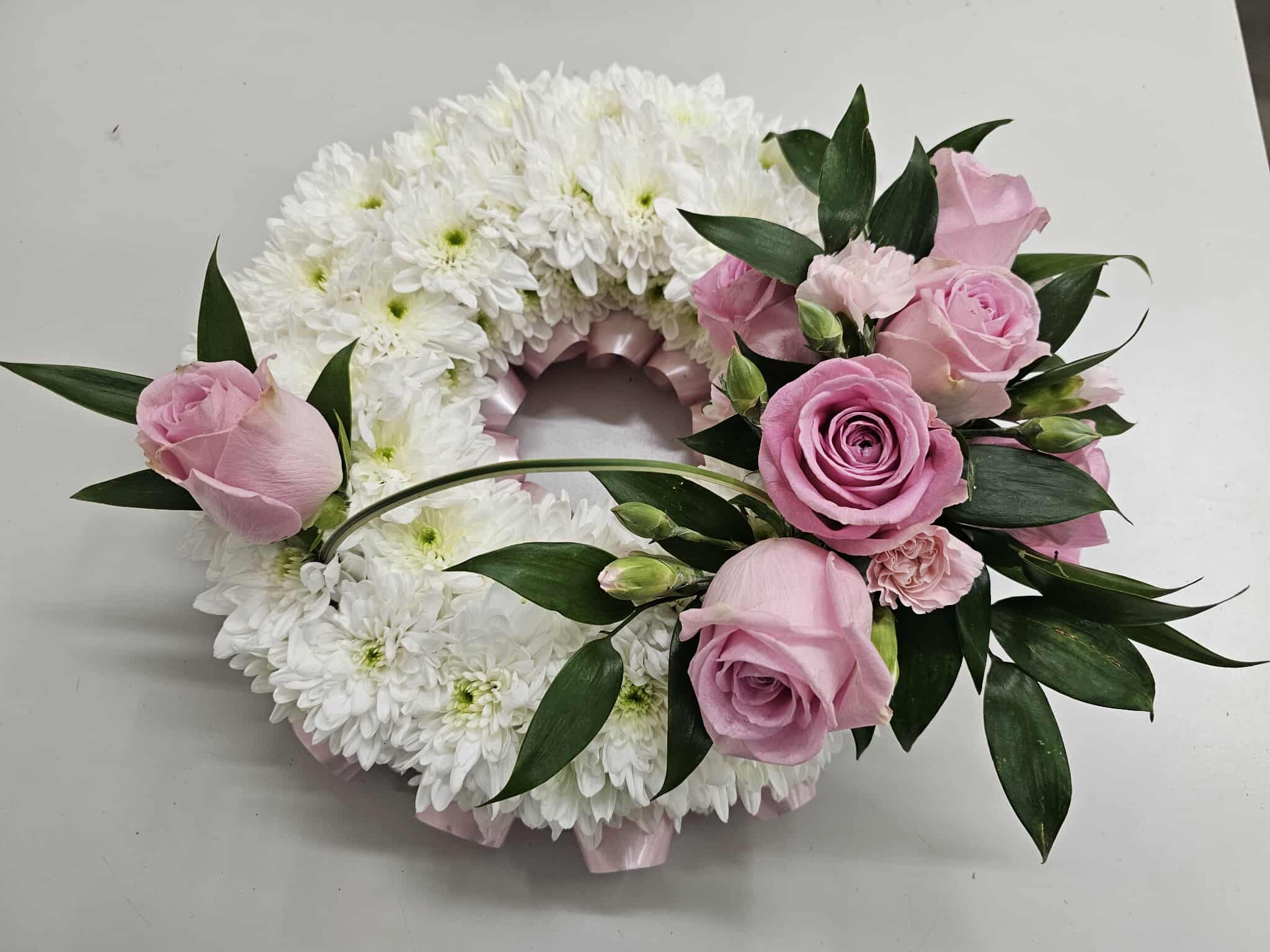 Soft pink and white floral tribute