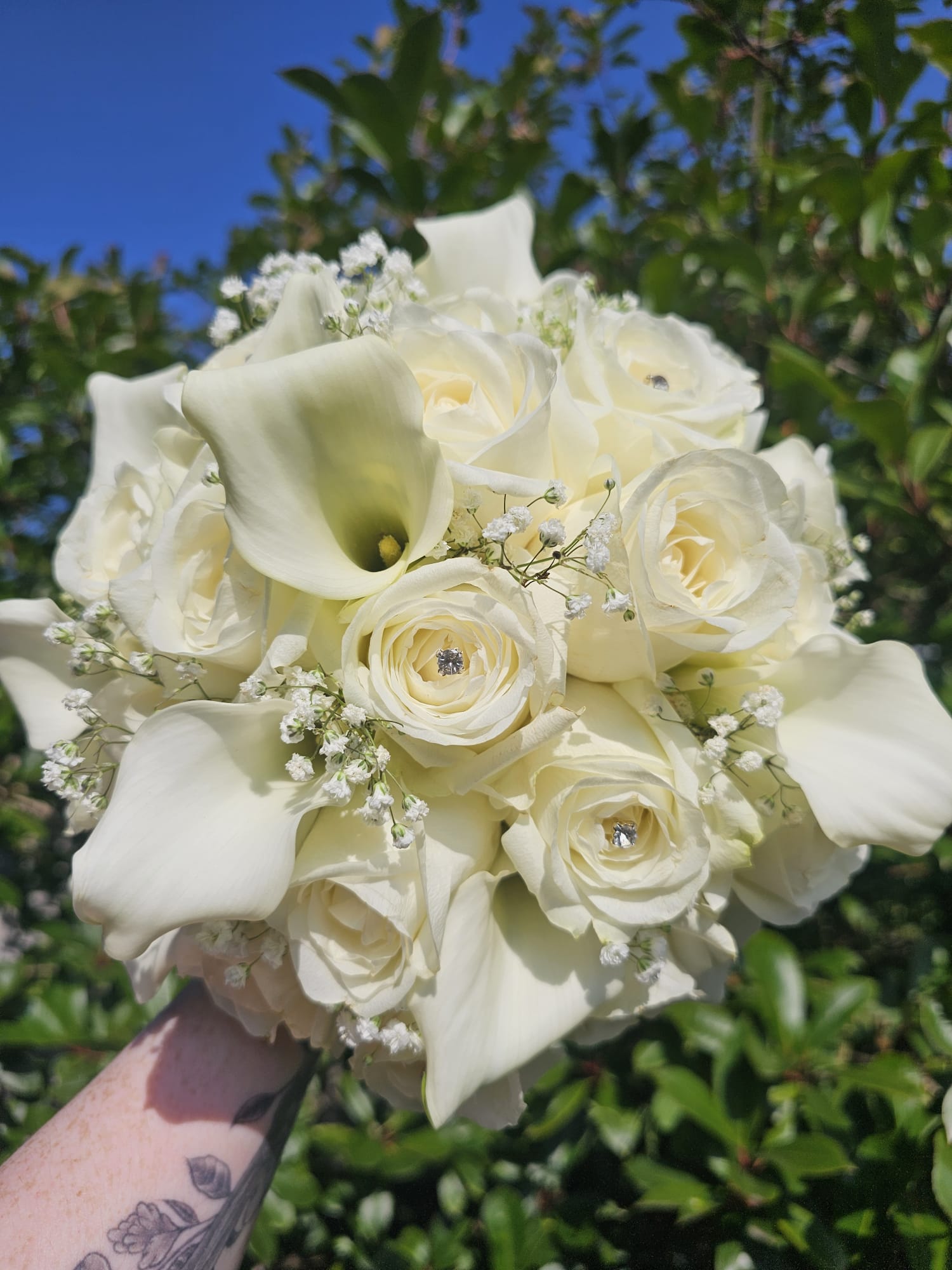 Elegant white bridal bouquet created by Making It Bloom
