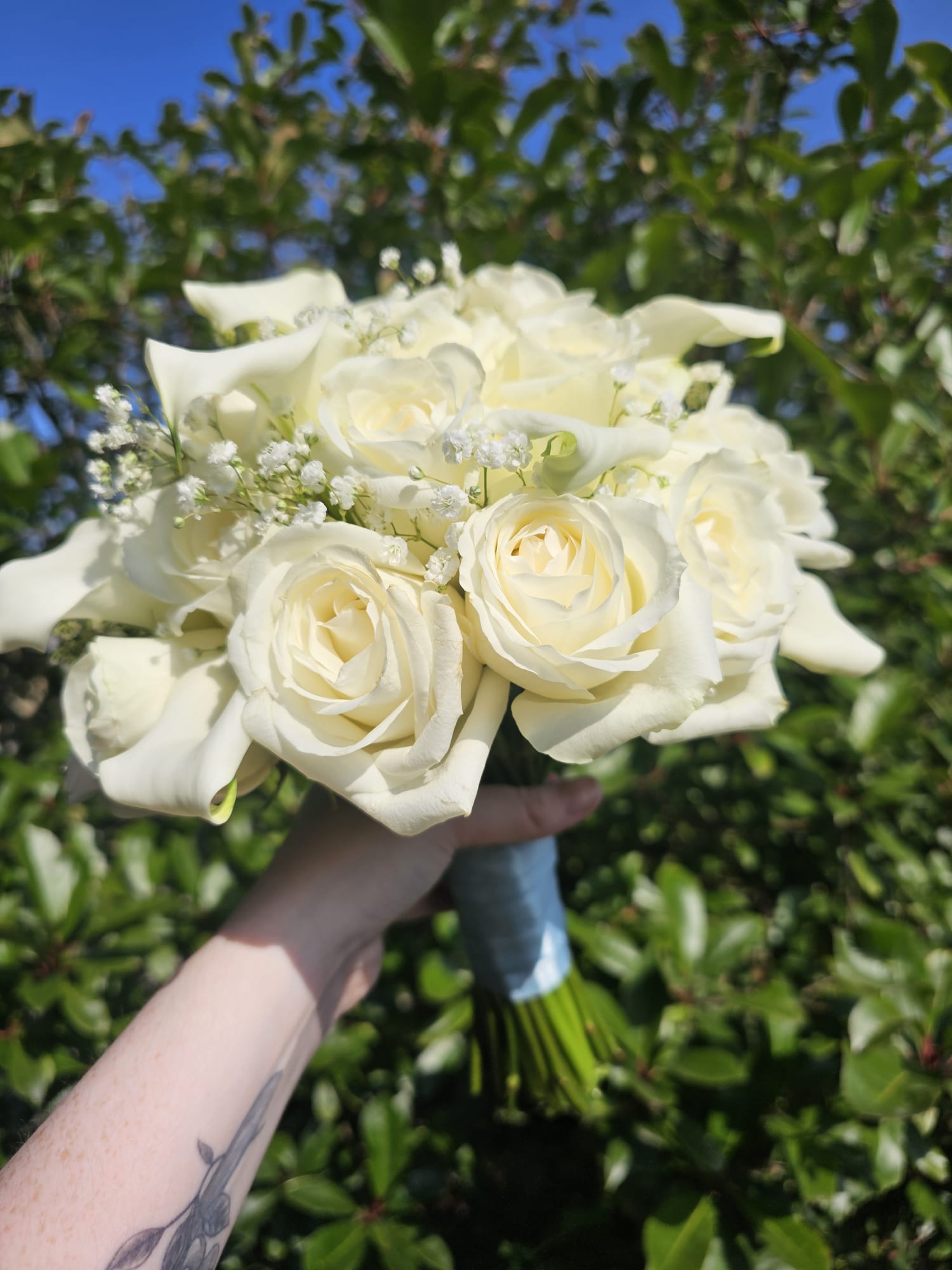 Elegant white bridal bouquet created by Making It Bloom